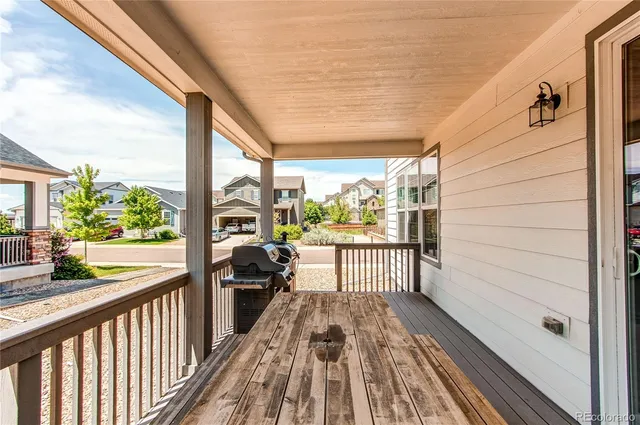 a view of a balcony with wooden floor