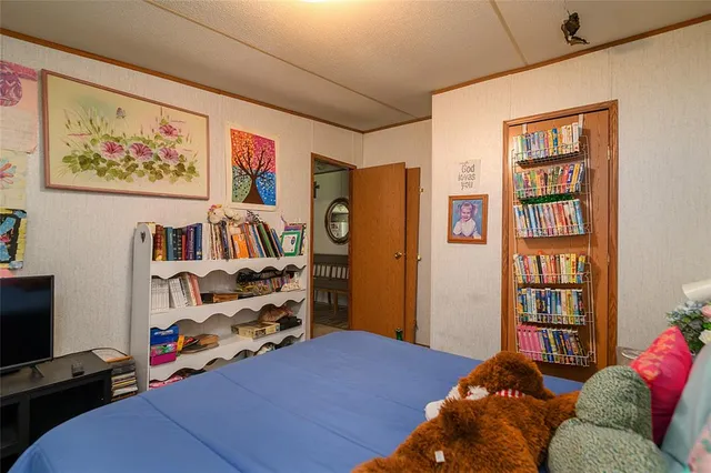 a bedroom with a bed and furniture