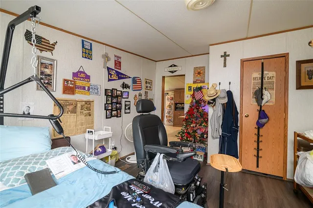 a view of a workspace with furniture and wooden floor