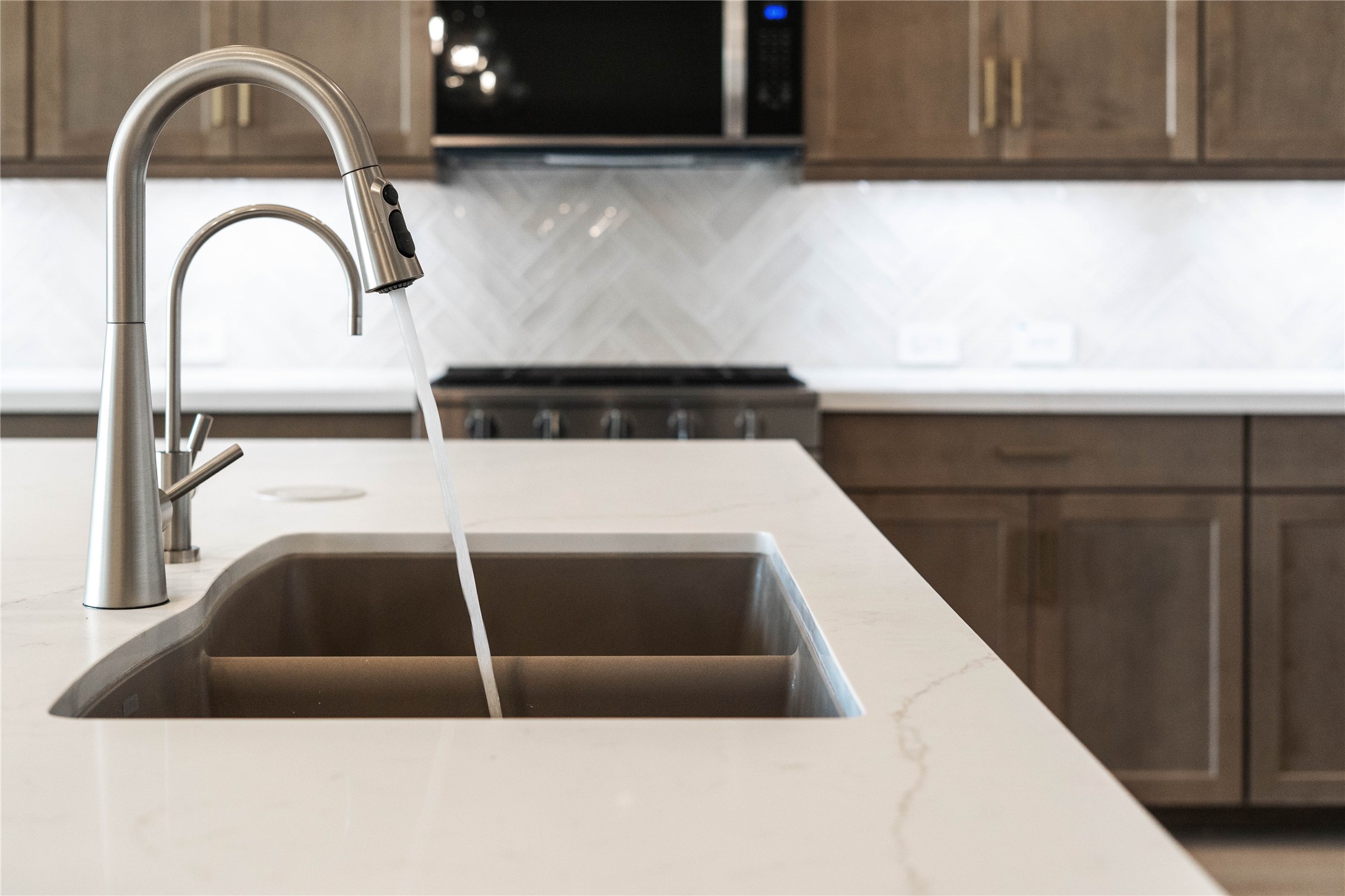 9123 Petroglyph Pt Court Porter, TX 77365 - Photo 21 of 43 The modern stainless steel undermount sink with Contemporary Series faucet and water filtration system.