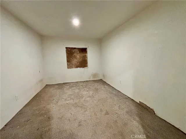 a front view of a house with barbeque oven