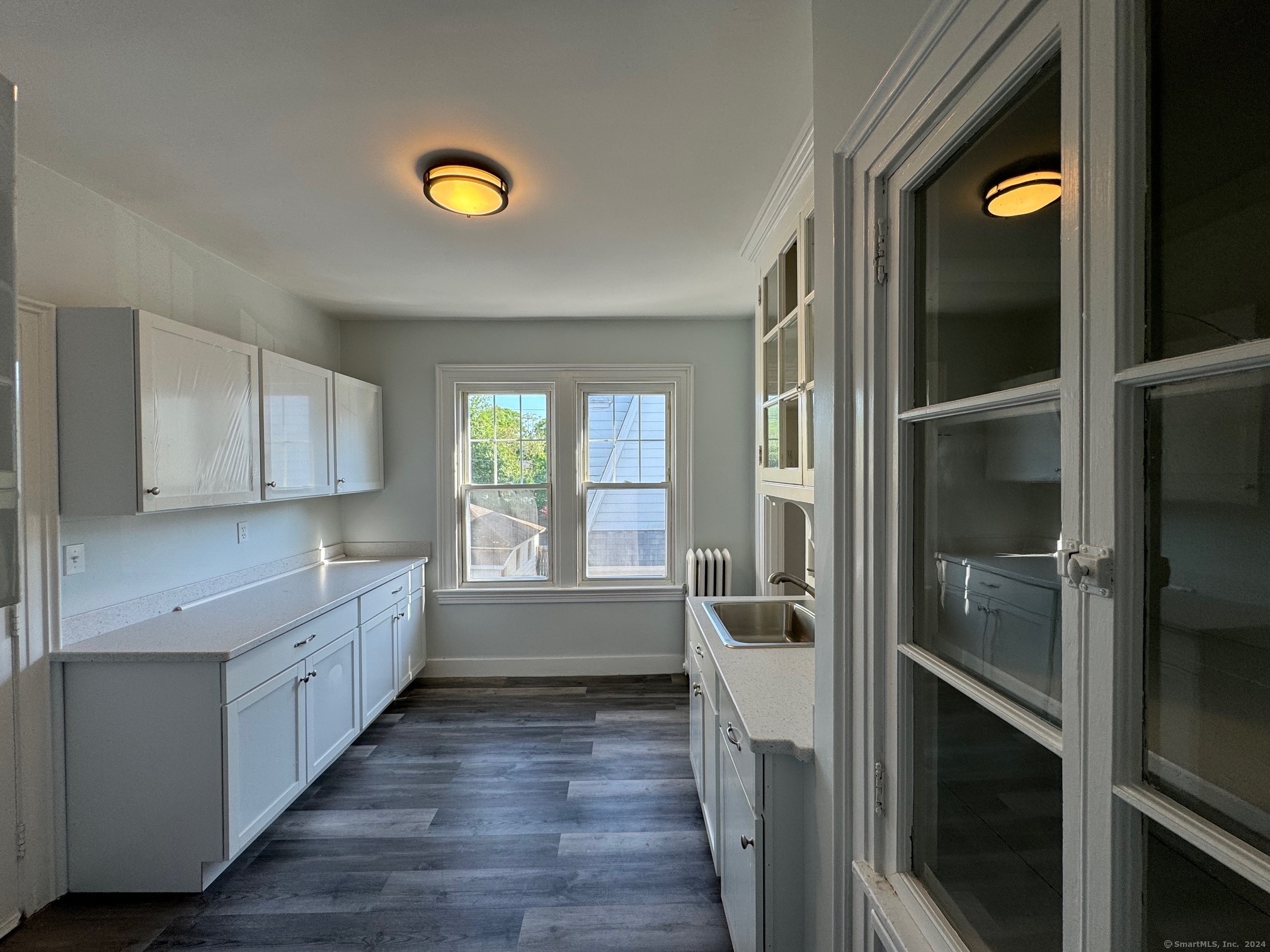 1253 Forest Road, Unit 2 New Haven, CT 06515 - Photo 20 of 30 a kitchen with a refrigerator and a stove