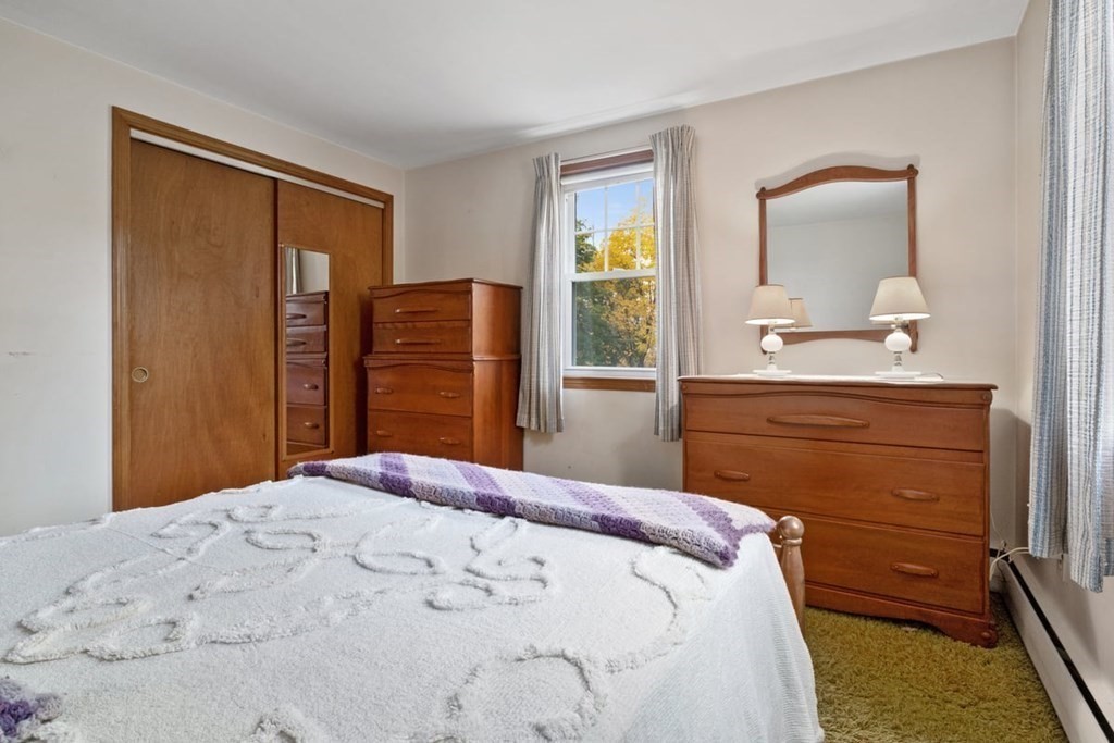 29 Irving Drive Walpole, MA 02081 - Photo 12 of 33 a bedroom with a bed and a dresser