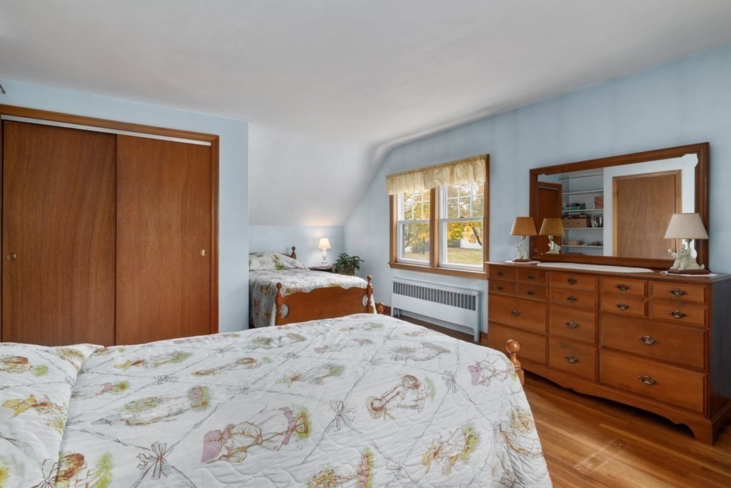 29 Irving Drive Walpole, MA 02081 - Photo 14 of 33 a bedroom with a bed and a dresser