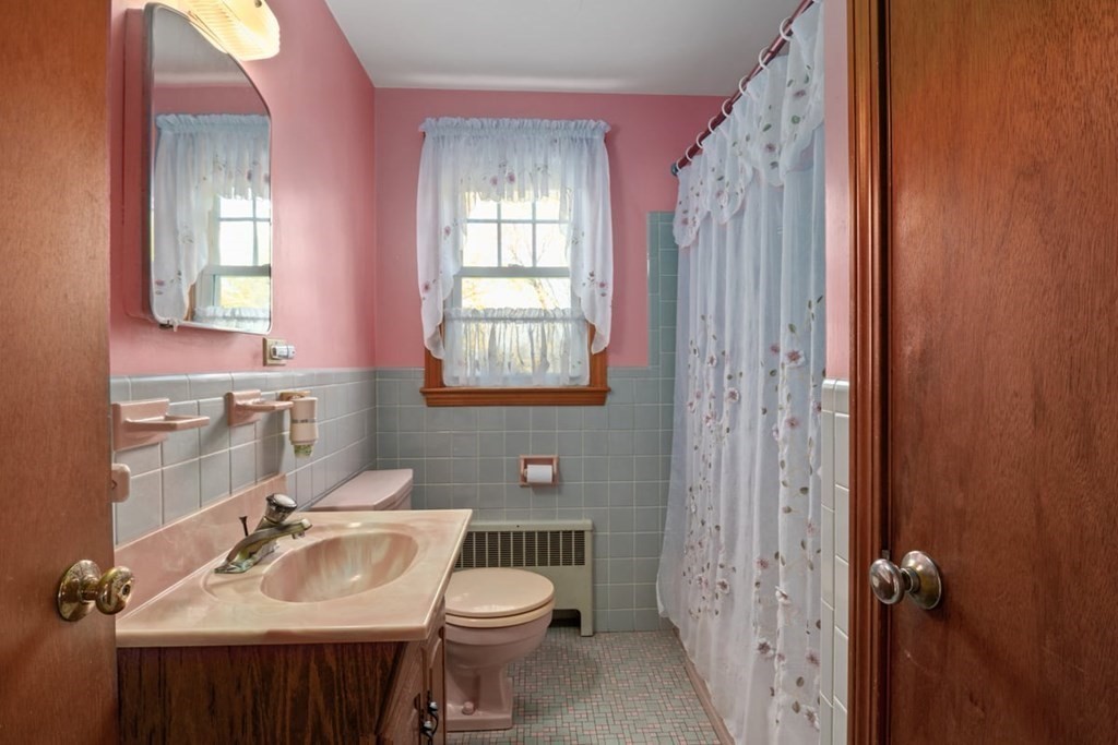 29 Irving Drive Walpole, MA 02081 - Photo 18 of 33 a bathroom with a sink toilet and shower