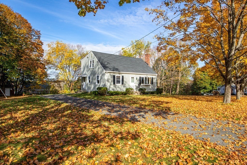 29 Irving Drive Walpole, MA 02081 - Photo 26 of 33 a house with trees in front of it