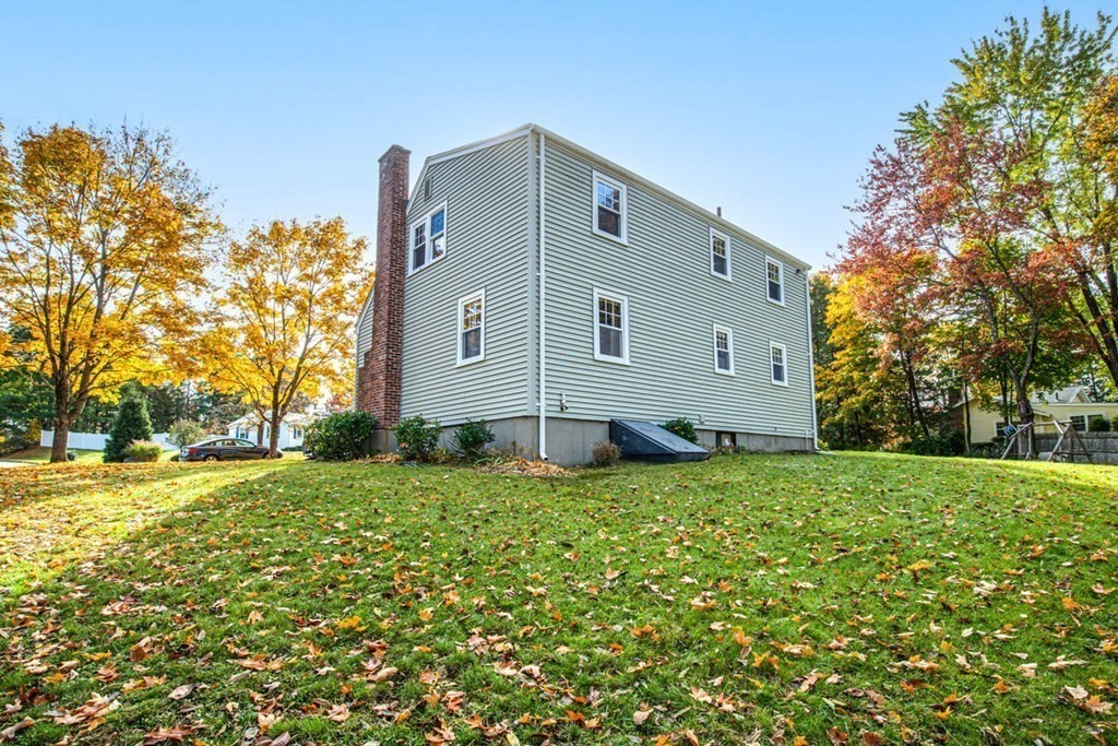 29 Irving Drive Walpole, MA 02081 - Photo 28 of 33 a front view of house with yard and trees around