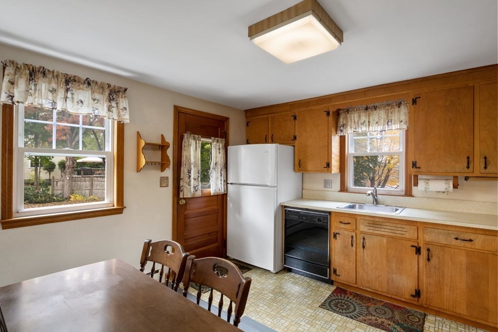 29 Irving Drive Walpole, MA 02081 - Photo 6 of 33 a kitchen with a refrigerator and a sink