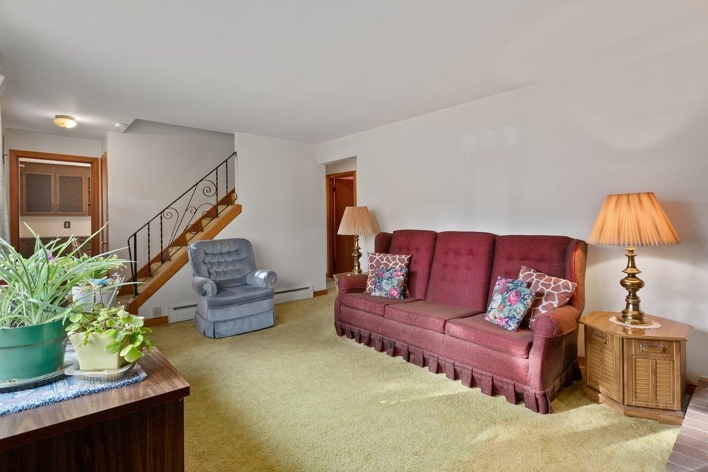29 Irving Drive Walpole, MA 02081 - Photo 10 of 33 a living room with furniture and flowers