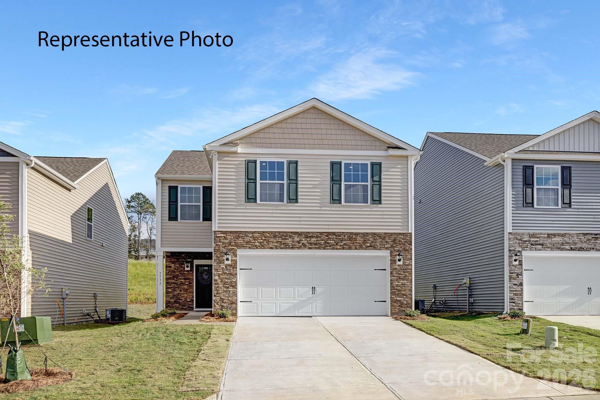 2053 Moorside Court Lancaster, SC 29720 - Photo 1 of 26 a front view of a house with yard