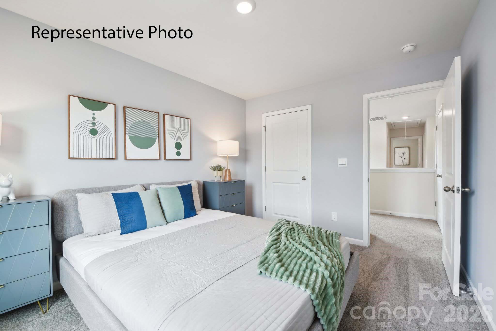 2053 Moorside Court Lancaster, SC 29720 - Photo 13 of 26 a bedroom with a bed and painting on the wall