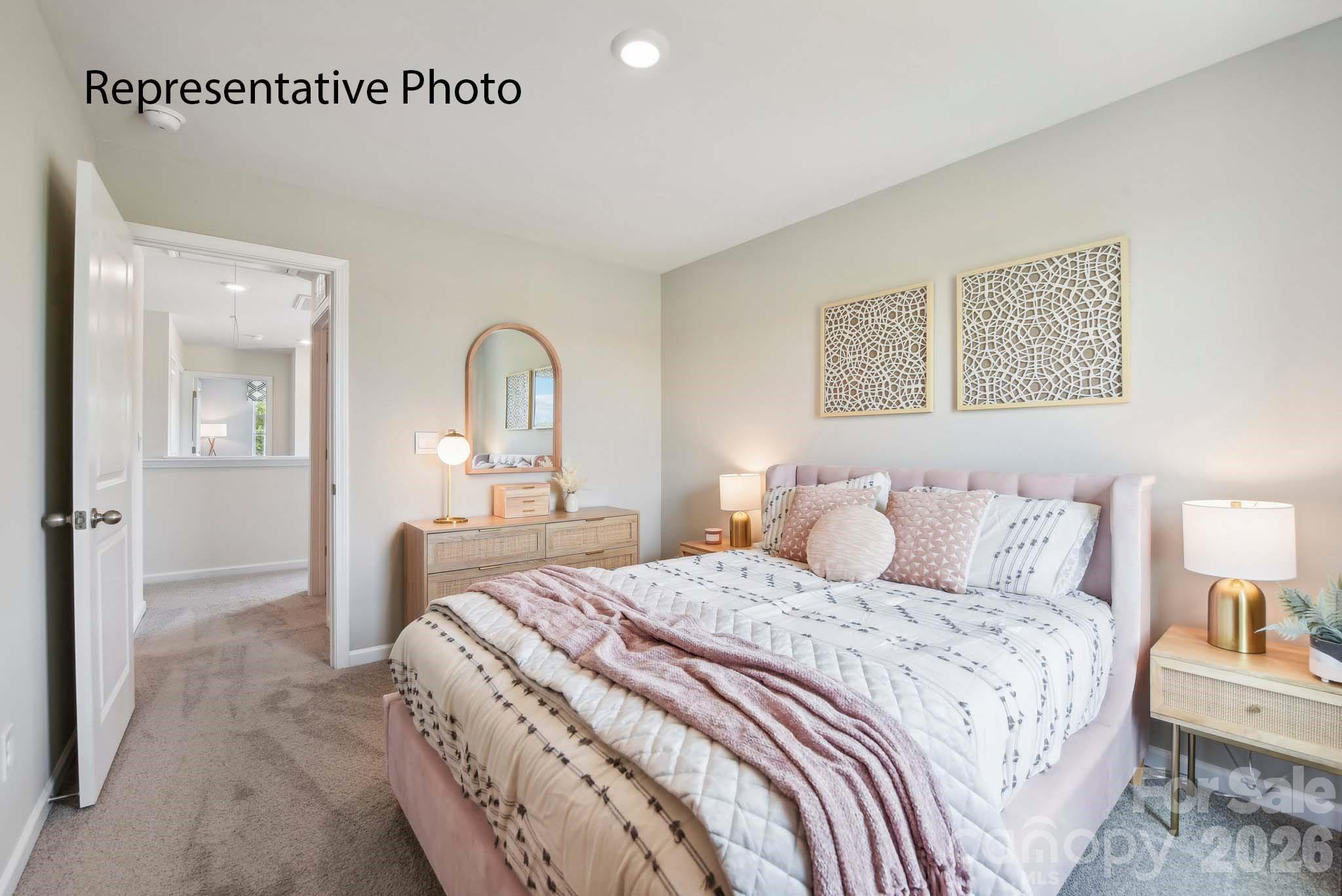 2053 Moorside Court Lancaster, SC 29720 - Photo 24 of 26 a bedroom with a bed and a mirror