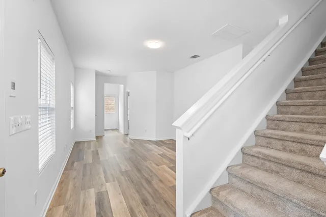a view of entryway with wooden floor