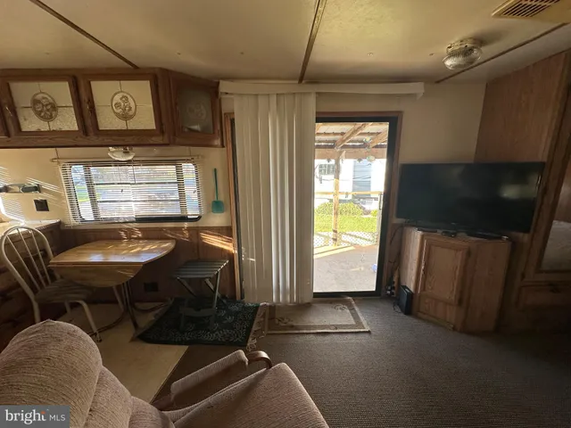 a livingroom with furniture window and wooden floor