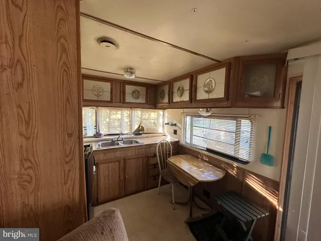 a kitchen with a stove and a refrigerator