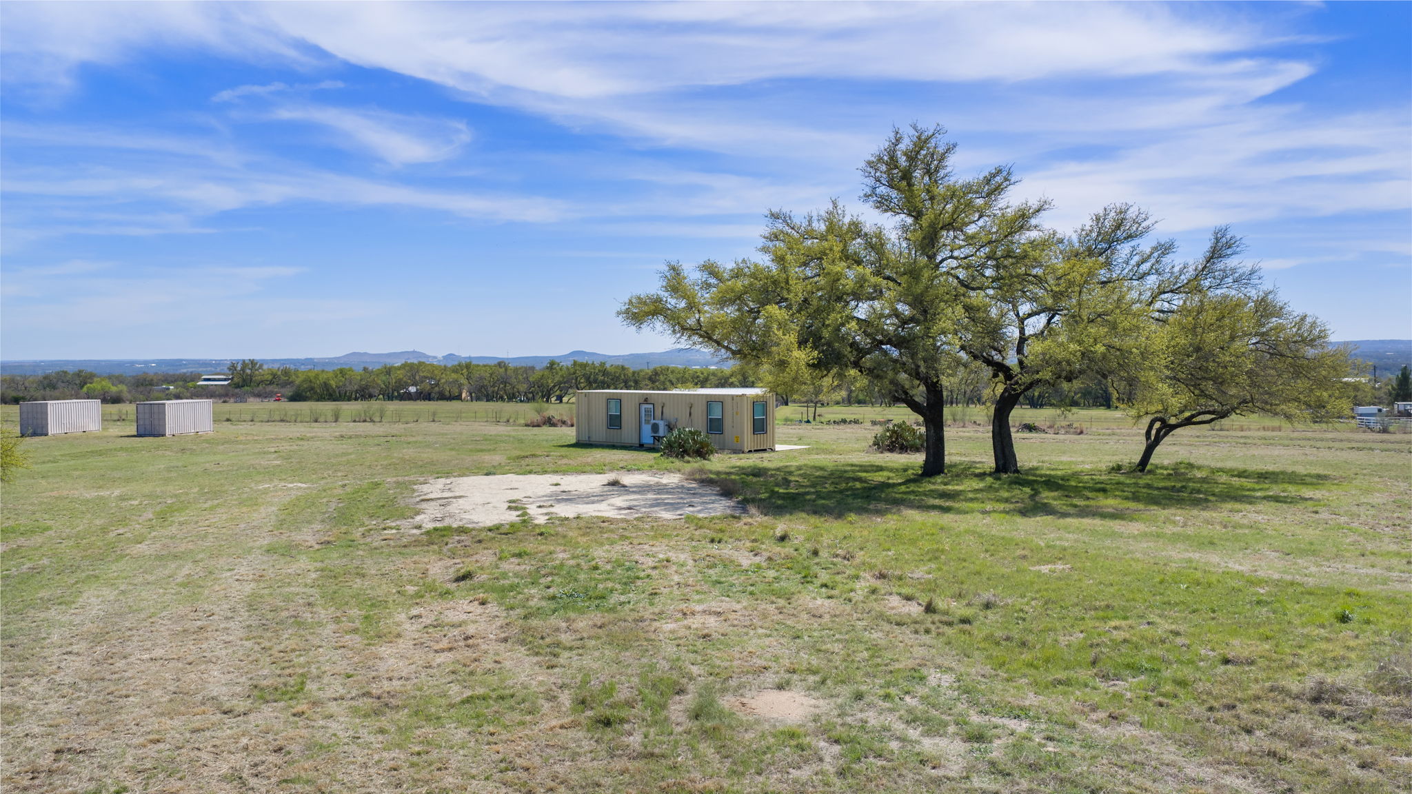 2502 Ranch Road 1323 Johnson City, TX 78636 - Photo 22 of 40 a view of a yard with a house in the background