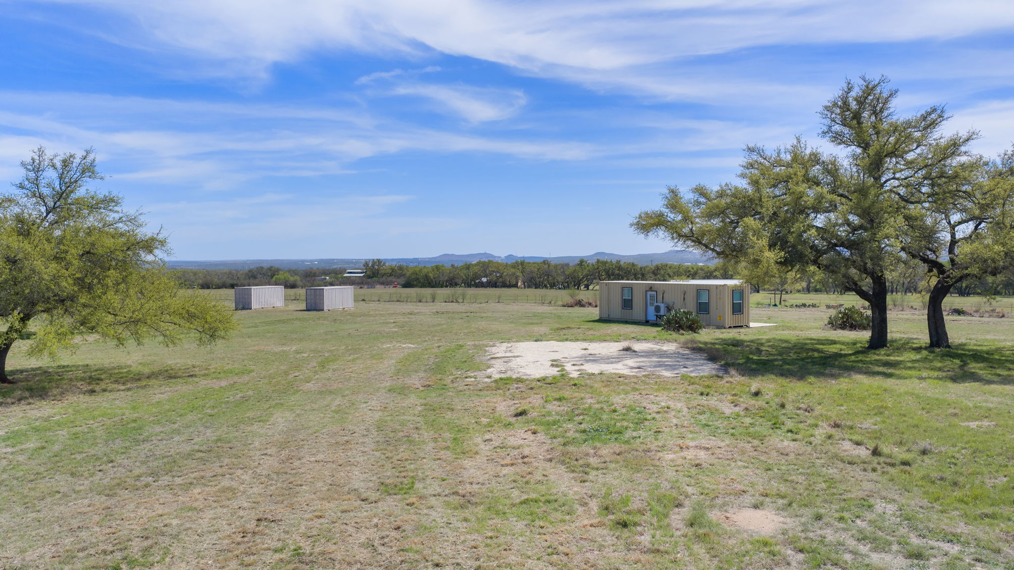 2502 Ranch Road 1323 Johnson City, TX 78636 - Photo 23 of 40 a view of a house with a yard