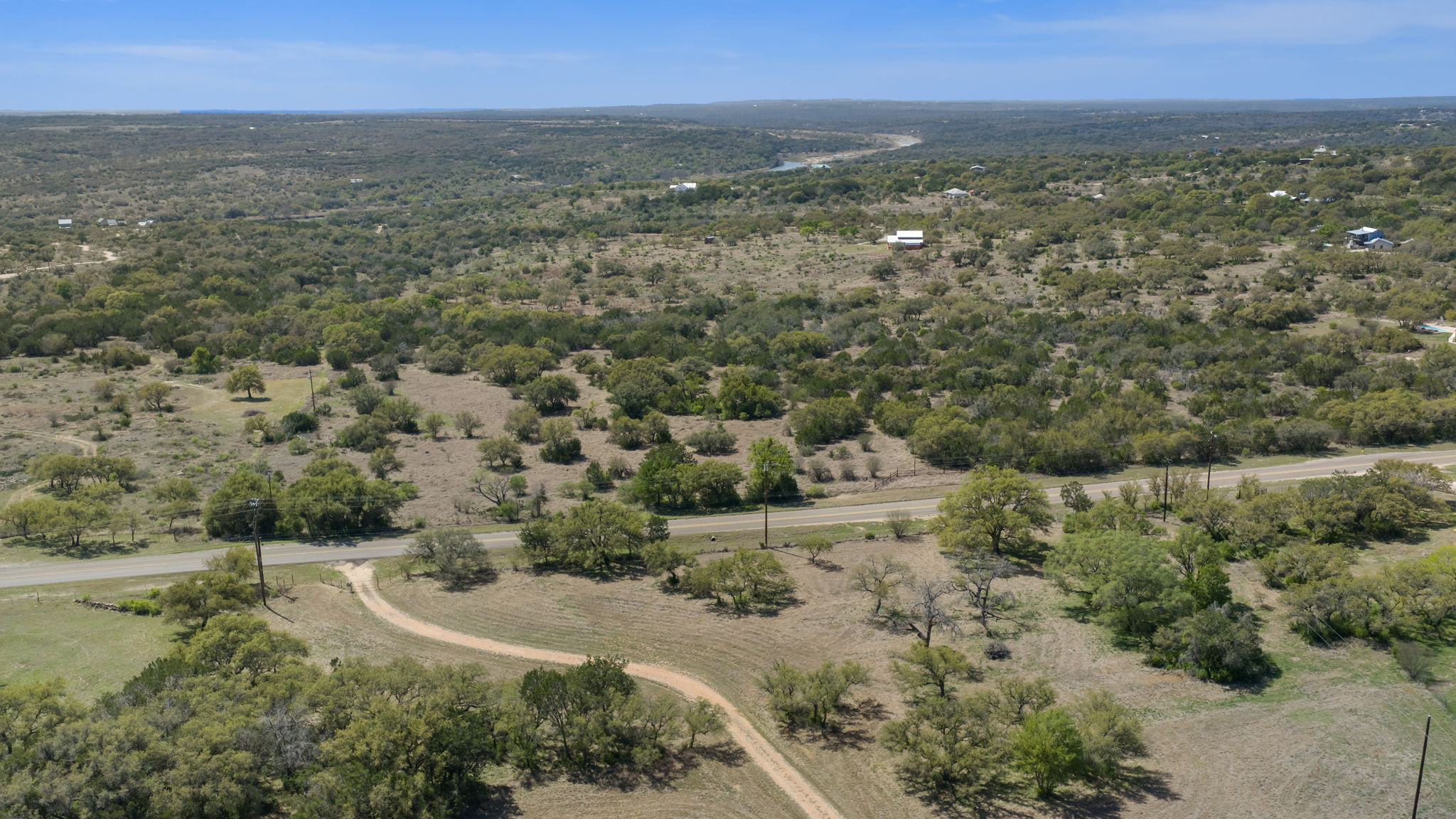 2502 Ranch Road 1323 Johnson City, TX 78636 - Photo 34 of 40 an aerial view of residential houses with outdoor space and trees