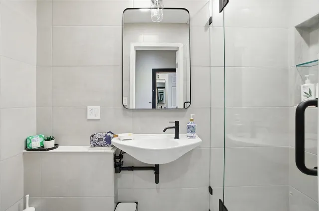 a view of hallway with wooden floor
