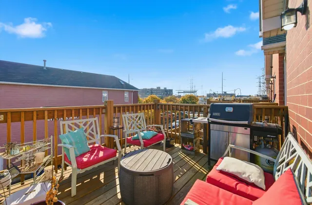 a view of a balcony with chairs