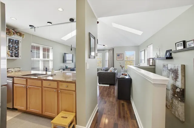 a kitchen with a sink and refrigerator