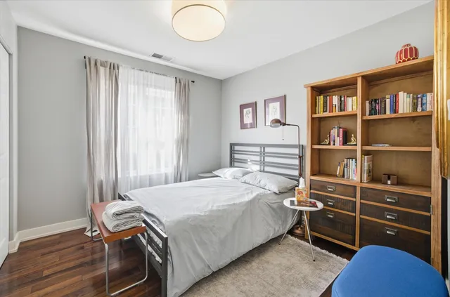 a spacious bathroom with a granite countertop sink mirror vanity and toilet