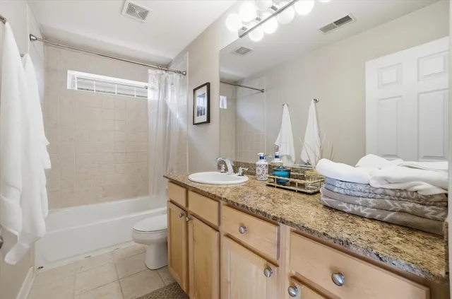 a bathroom with a sink a mirror and a shower