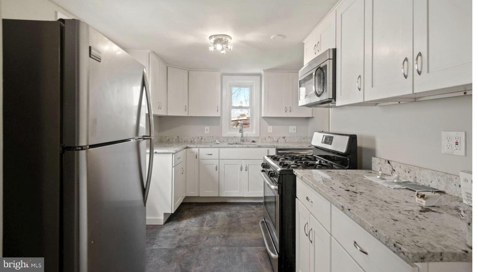 1238 U Street Southeast Washington, DC 20020 - Photo 7 of 12 Modern kitchen with sleek finishes.