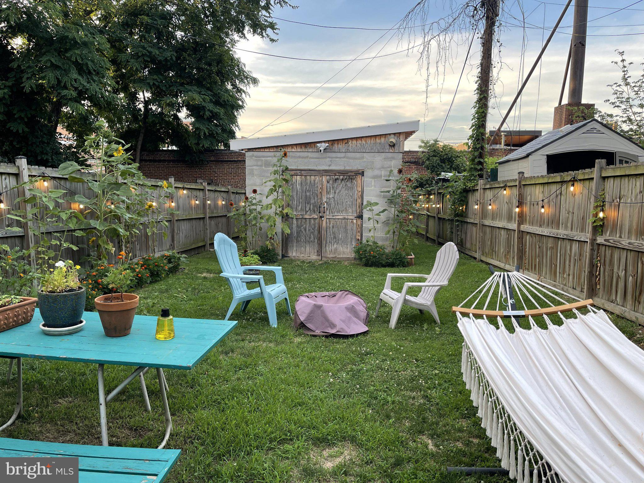 1238 U Street Southeast Washington, DC 20020 - Photo 10 of 12 Charming backyard retreat at dusk.