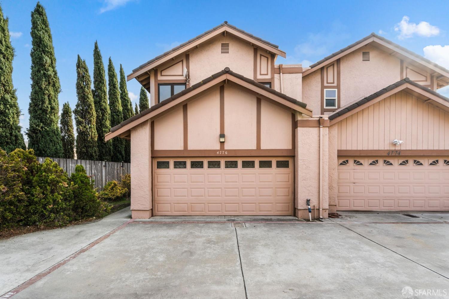 4776 Snow Drive San Jose, CA 95111 - Photo 2 of 3 a view of a house with a yard and garage
