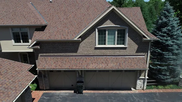 a front view of a house with a garage