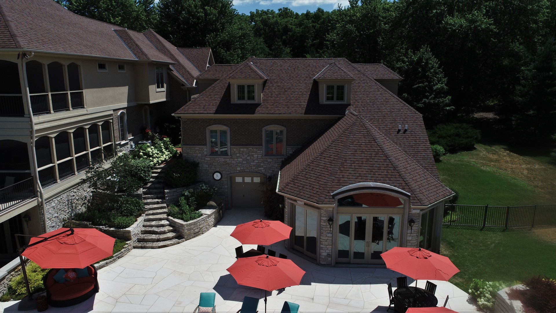 419 North Valley Hill Road Bull Valley, IL 60098 - Photo 7 of 16 a front view of a house with a yard fire pit and outdoor seating