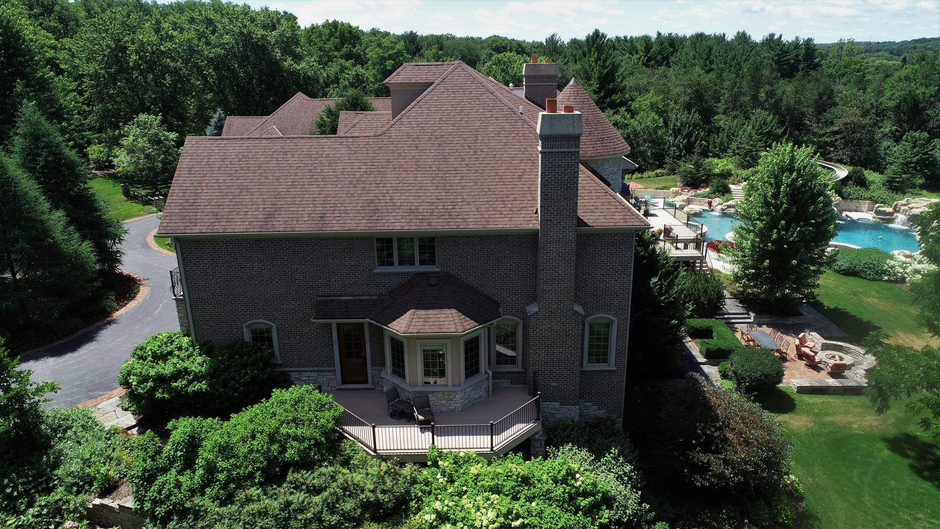 419 North Valley Hill Road Bull Valley, IL 60098 - Photo 9 of 16 an aerial view of a house with a yard and mountain view in back