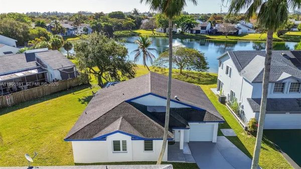 an aerial view of a house with swimming pool