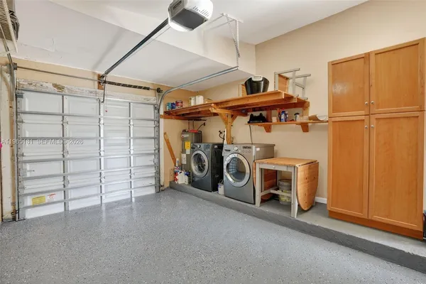 a view of a storage & utility room with washer and dryer