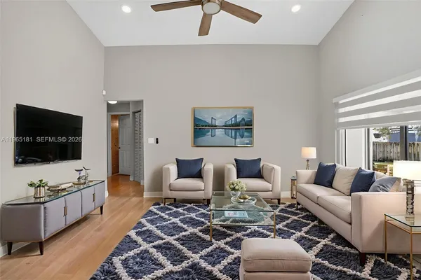 a living room with furniture and a flat screen tv