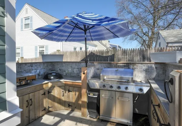 a view of a chairs and table in a patio
