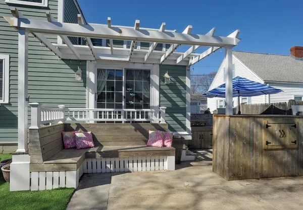 a view of a chair and tables in the patio