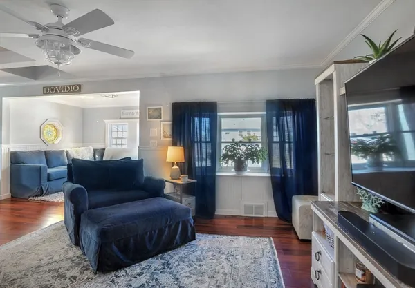 a living room with furniture and a window