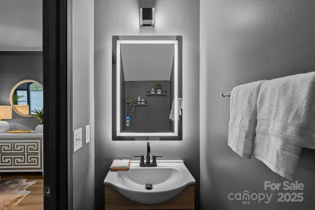 a bathroom with a sink and mirror