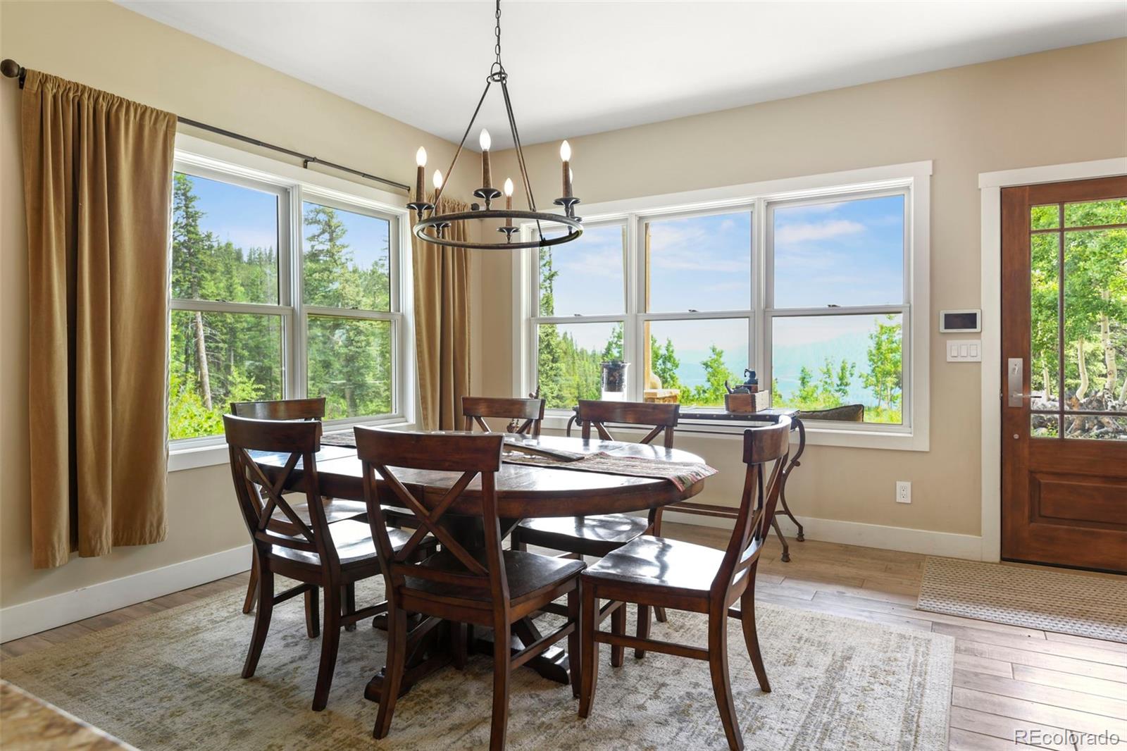 1555 Three Peaks Road Black Hawk, CO 80422 - Photo 21 of 50 a view of a dining room with furniture window and outside view