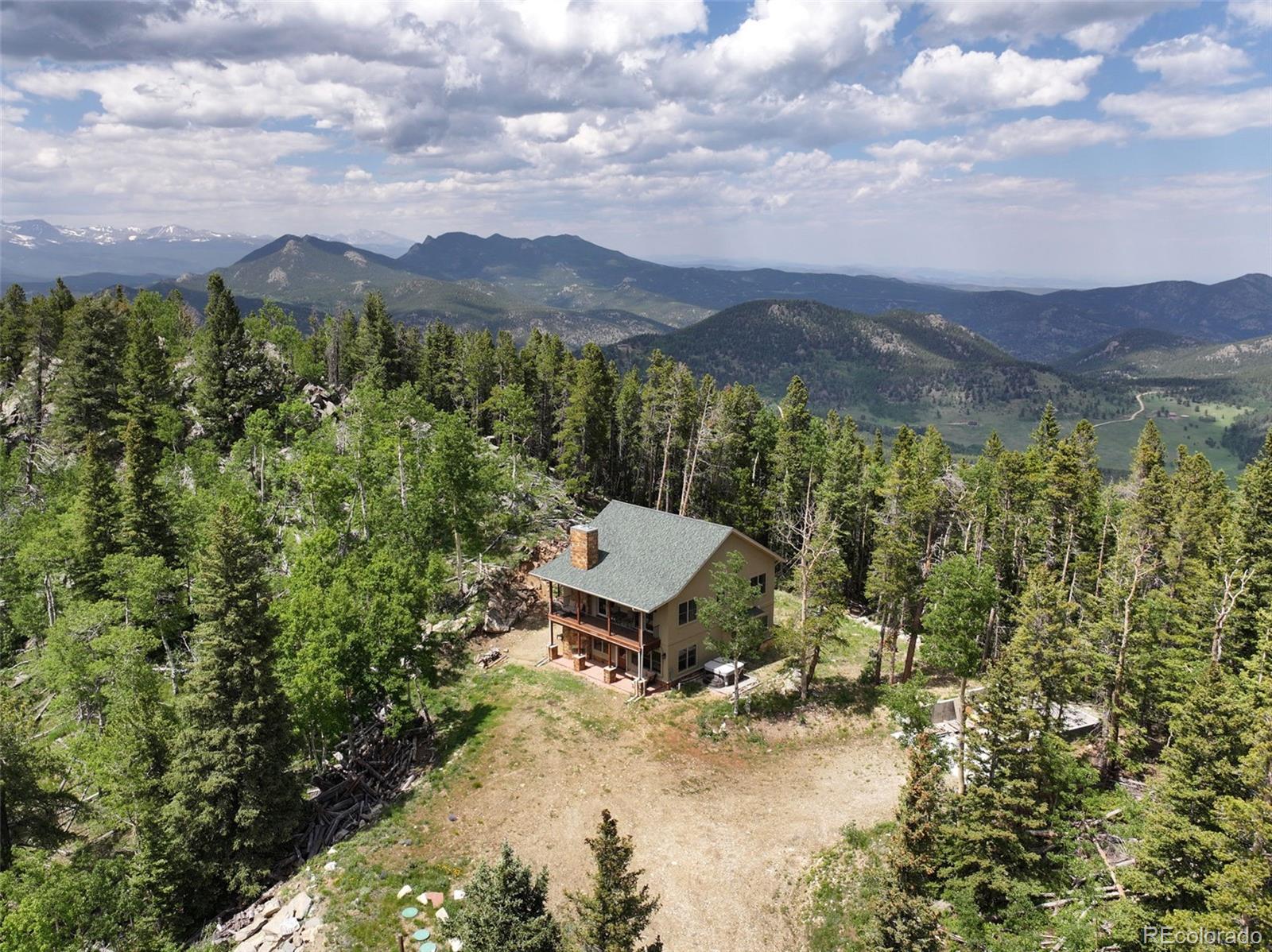 1555 Three Peaks Road Black Hawk, CO 80422 - Photo 3 of 50 a view of a city with a mountain