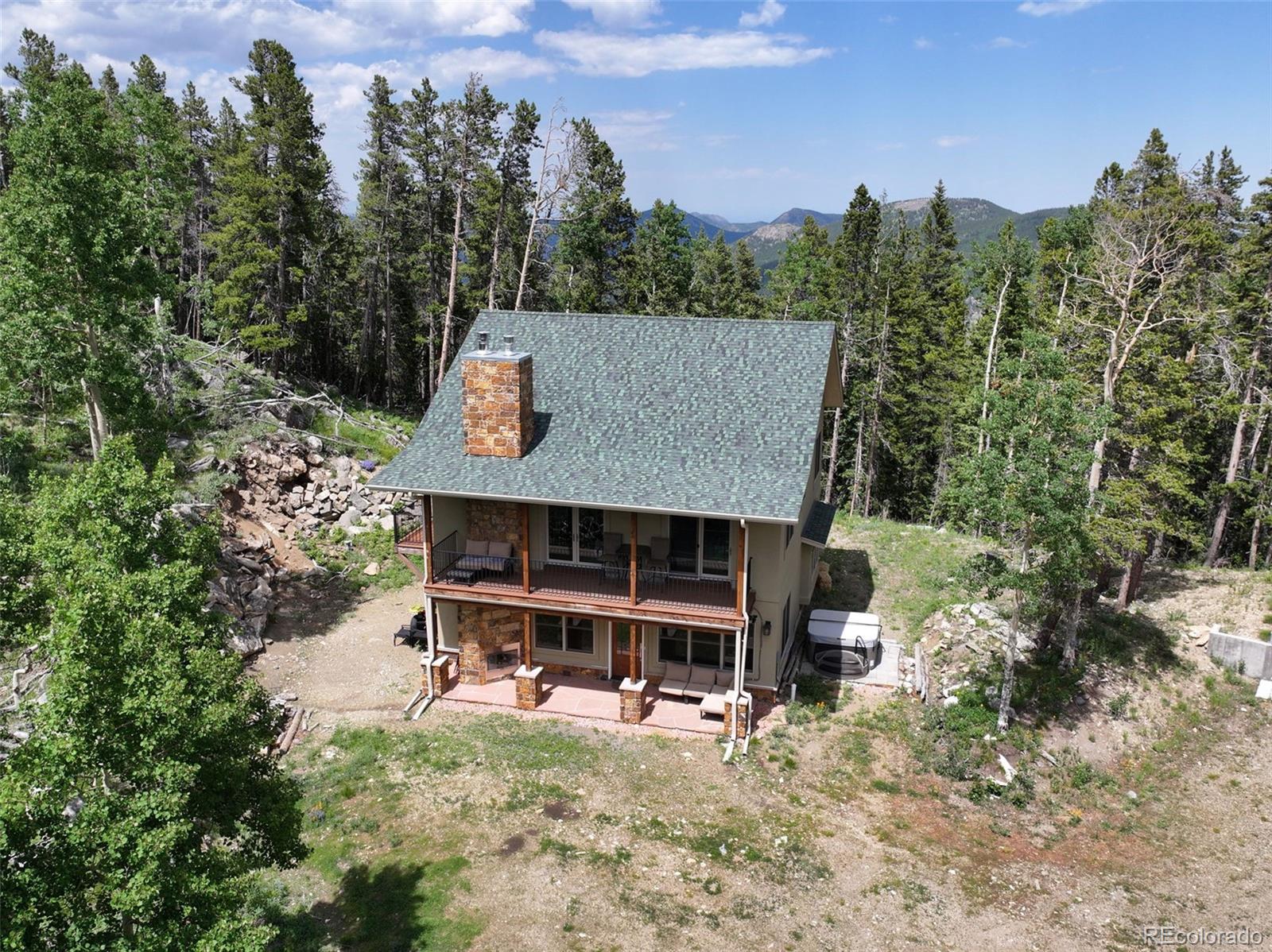 1555 Three Peaks Road Black Hawk, CO 80422 - Photo 4 of 50 a view of house with outdoor space and sitting area
