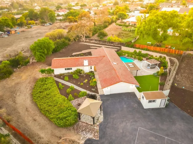 an aerial view of a house with a garden