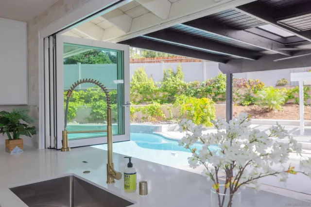 a spacious bedroom with a bed and a couch