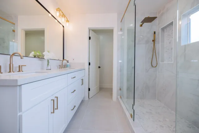 a bathroom with a sink double vanity and a mirror