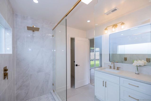 a bathroom with a double vanity sink mirror and double