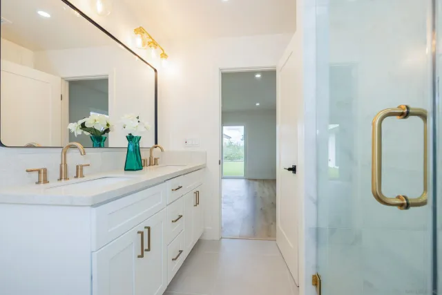 a bathroom with a toilet sink and shower