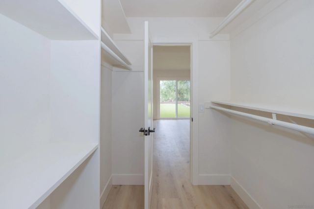 a view of a livingroom with furniture and a window