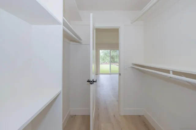 a view of a livingroom with furniture and a window